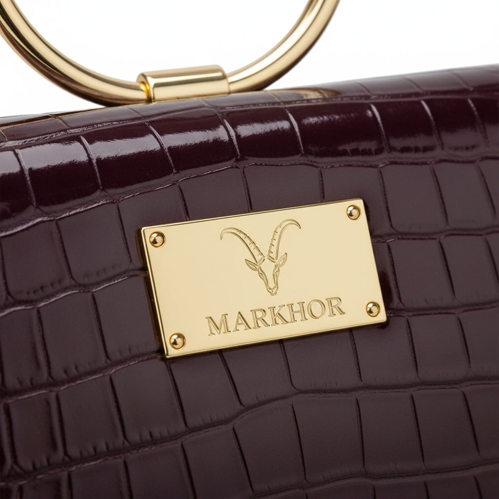 LS05 MARKHOR Gold Logo Plate Detail